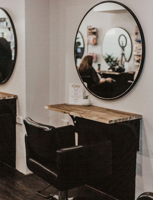 Styling chair and a mirror in Cameo Rose Hair Salon